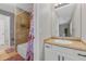 Bright bathroom offers a vanity with sink, adjacent toilet and tiled shower/tub combination, and modern fixtures at 1379 S Idalia St # C, Aurora, CO 80017