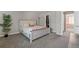 This spacious bedroom features a large bed, soft carpet, a large potted plant and ample closet space at 1379 S Idalia St # C, Aurora, CO 80017