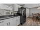 Efficient kitchen features white cabinetry and black appliances at 1379 S Idalia St # C, Aurora, CO 80017