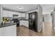 Efficient kitchen features white cabinetry and black appliances at 1379 S Idalia St # C, Aurora, CO 80017