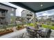 Inviting backyard patio area features a comfortable seating area and well-maintained landscaping at 6950 Hidden Cove Ct, Castle Pines, CO 80108