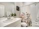 Bright bathroom with a decorative shower curtain, white subway tile, and a sleek vanity at 6950 Hidden Cove Ct, Castle Pines, CO 80108