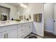 Bathroom featuring double vanity with modern fixtures and hardware at 6950 Hidden Cove Ct, Castle Pines, CO 80108