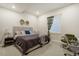 Comfortable bedroom features a large bed, stylish decor, and a dedicated workspace for productivity at 6950 Hidden Cove Ct, Castle Pines, CO 80108