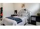 Bedroom featuring a black metal bed frame, desk and streamlined lighting at 6950 Hidden Cove Ct, Castle Pines, CO 80108
