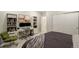 Organized bedroom features a work-from-home setup, closet storage, and neutral decor at 6950 Hidden Cove Ct, Castle Pines, CO 80108