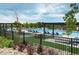 Well-maintained community pool area featuring lounge chairs and shaded pergolas at 6950 Hidden Cove Ct, Castle Pines, CO 80108