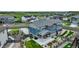Aerial view of a blue home with a well-maintained backyard and patio area at 6950 Hidden Cove Ct, Castle Pines, CO 80108