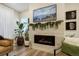 Living room showcasing a modern fireplace, hardwood floors, and contemporary decor at 6950 Hidden Cove Ct, Castle Pines, CO 80108