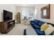 Cozy living room featuring a massage chair, large TV, and comfortable seating at 6950 Hidden Cove Ct, Castle Pines, CO 80108