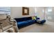 Cozy living room featuring a massage chair, large TV, and comfortable seating at 6950 Hidden Cove Ct, Castle Pines, CO 80108
