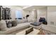 Inviting living room showcases comfortable seating, exercise equipment, and a fun, creative calendar at 6950 Hidden Cove Ct, Castle Pines, CO 80108
