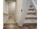 Carpeted staircase offers neutral color palette and leads to multiple levels at 6950 Hidden Cove Ct, Castle Pines, CO 80108