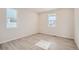 Bright bedroom showcasing large windows, neutral walls, and modern flooring at 1300 Loraine N Cir, Lafayette, CO 80026