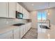 Modern kitchen featuring sleek countertops, stainless steel appliances, and ample cabinet space at 1300 Loraine N Cir, Lafayette, CO 80026