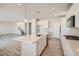 Spacious kitchen showcasing a large island, stainless steel appliances, and an open concept design at 1300 Loraine N Cir, Lafayette, CO 80026