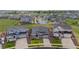 Aerial view of well-maintained homes showcases the neighborhood and manicured landscaping at 1677 Meagan Way, Erie, CO 80516
