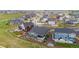 Aerial view of houses with yards and landscaping, highlighting location and community at 1677 Meagan Way, Erie, CO 80516