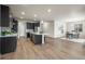 Kitchen island overlooks the dining area in this open concept home at 1677 Meagan Way, Erie, CO 80516