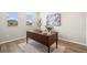 Cozy office space with a stylish desk, bright windows, and calm decor creates a perfect work-from-home environment at 1677 Meagan Way, Erie, CO 80516