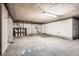 Spacious unfinished basement ready for customization or storage, with concrete flooring and exposed ceiling at 1950 N Logan St # 108, Denver, CO 80203