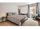 Bright and comfortable bedroom, complete with a large window and a desk at 1950 N Logan St # 108, Denver, CO 80203