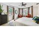 Bright bedroom featuring large windows, neutral decor, and ample natural light at 1950 N Logan St # 108, Denver, CO 80203