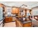 Open kitchen with custom wood cabinetry and granite countertops, ideal for meal prep and entertaining at 1950 N Logan St # 108, Denver, CO 80203