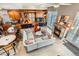 Bright living room with hardwood floors, fireplace, and custom built-ins at 1950 N Logan St # 108, Denver, CO 80203