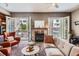 Comfortable living room with fireplace and balcony access, perfect for relaxing and enjoying the view at 1950 N Logan St # 108, Denver, CO 80203