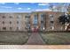 Brick apartment building with tidy landscaping and a welcoming entrance at 525 Jackson St # 303, Denver, CO 80206