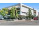 Modern building featuring a Room & Board store with a sleek white facade and large windows at 525 Jackson St # 303, Denver, CO 80206