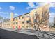 Apartment building with a brick exterior and red doors at 525 Jackson St # 303, Denver, CO 80206