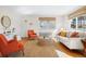 Bright living room with hardwood floors, neutral walls, and stylish furnishings at 525 Jackson St # 303, Denver, CO 80206