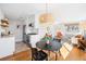 Open living space with updated kitchen, dining area, and comfortable seating arrangement at 525 Jackson St # 303, Denver, CO 80206