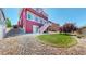 Backyard with a small grassy area and a well-maintained stone landscape at 172 Painted Horse Way, Erie, CO 80516