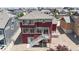 Aerial view of backyard and deck on a two-story home in residential neighborhood at 172 Painted Horse Way, Erie, CO 80516
