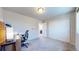 Carpeted bedroom featuring sliding-door closet, neutral walls, and space for a desk to be used as an office at 172 Painted Horse Way, Erie, CO 80516