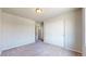 This carpeted bedroom is a blank canvas to create a relaxing space with a large sliding door closet for storage at 172 Painted Horse Way, Erie, CO 80516