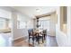 Charming dining room featuring an elegant table, chair set, and bright lighting at 172 Painted Horse Way, Erie, CO 80516