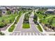 Welcoming neighborhood entryway with manicured landscaping, decorative statues, and community signage at 172 Painted Horse Way, Erie, CO 80516
