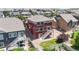 Aerial view of a two-story home with a well-maintained backyard at 172 Painted Horse Way, Erie, CO 80516