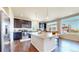 Spacious kitchen with granite countertops, stainless steel appliances, and hardwood floors at 172 Painted Horse Way, Erie, CO 80516