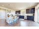 Well-lit kitchen featuring modern appliances, ample counter space, and hardwood flooring at 172 Painted Horse Way, Erie, CO 80516