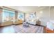 Bright living room with large windows, hardwood floors and stylish furnishings at 172 Painted Horse Way, Erie, CO 80516