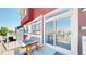 Cozy outdoor patio with wooden table, benches, and sliding glass doors at 172 Painted Horse Way, Erie, CO 80516