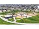 Community playground featuring modern equipment, shaded picnic area, and central lawn for Gathering recreation at 172 Painted Horse Way, Erie, CO 80516