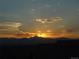 Beautiful sunset over mountain range enhances the scenic views from your property at 172 Painted Horse Way, Erie, CO 80516