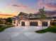 Stunning two-story home with a three-car garage and stone exterior at 6531 S Harlan Ct, Littleton, CO 80123