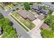 Aerial view of a home with a detached garage and a well-manicured lawn at 2501 E Arkansas Ave, Denver, CO 80210
